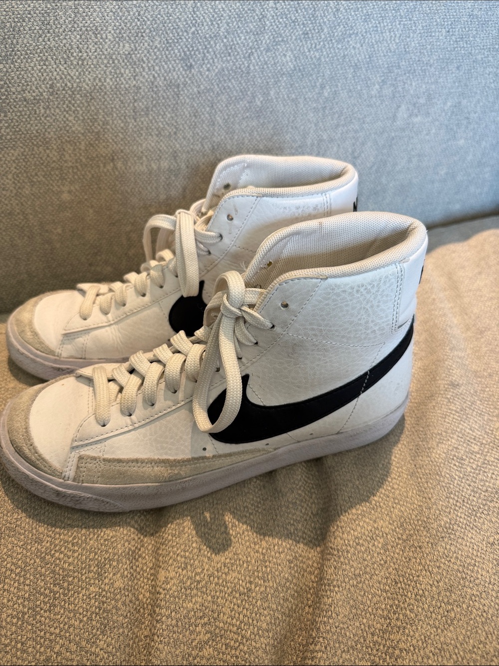 Nike White High-Top Sneakers with Black Swoosh